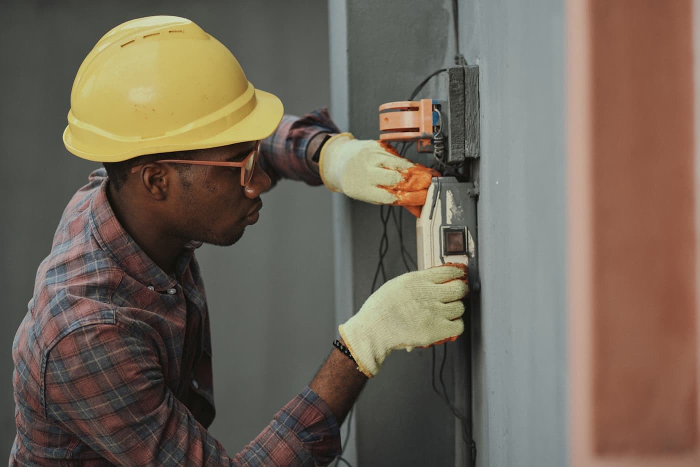 Fieldline electrician installing wiring in a panel